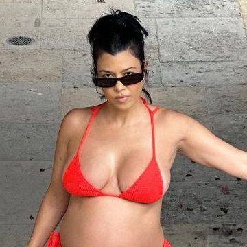kourtney kardashian posing in red bikini